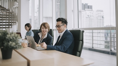 Asian-colleagues-having-meeting-window